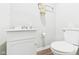 Clean, well-lit bathroom featuring a white vanity, toilet, and neutral wall color at 6413 N Wheeling Ave, Muncie, IN 47304