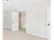 Bedroom with neutral carpet and an open closet at 6413 N Wheeling Ave, Muncie, IN 47304