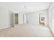 Spacious bedroom with neutral carpet, closet, and backyard access at 6413 N Wheeling Ave, Muncie, IN 47304