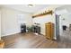 Dining room featuring hardwood floors, shelving, and ample natural light from a window at 6413 N Wheeling Ave, Muncie, IN 47304