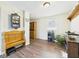 Bright dining room featuring hardwood floors, a decorative bench, and a window with natural light at 6413 N Wheeling Ave, Muncie, IN 47304