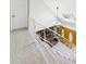 Entryway with carpeted stairs, decorative railing, skylight, and double doors at 6413 N Wheeling Ave, Muncie, IN 47304