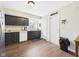 Functional kitchen offers dark cabinetry, white appliances, and ample counter space at 6413 N Wheeling Ave, Muncie, IN 47304