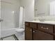 Functional bathroom featuring a vanity with a marble countertop, a tub-shower combo, and neutral finishes at 6524 Turf Way, Anderson, IN 46013