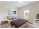 Cozy bedroom featuring a large bed, stylish decor, and a sunlit window that creates a peaceful ambiance at 6524 Turf Way, Anderson, IN 46013