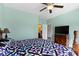 Spacious bedroom featuring a large window and ceiling fan at 6524 Turf Way, Anderson, IN 46013