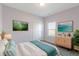 Tastefully decorated bedroom with elegant furnishings, soft lighting, and modern artwork at 6524 Turf Way, Anderson, IN 46013
