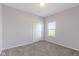 Comfortable bedroom featuring soft carpet, natural light, and a closet for easy storage and organization at 6524 Turf Way, Anderson, IN 46013