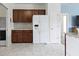 Kitchen area with stainless steel appliances, cabinets, and tile flooring at 6524 Turf Way, Anderson, IN 46013
