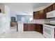 Spacious kitchen with stainless steel appliances and white tile flooring at 6524 Turf Way, Anderson, IN 46013
