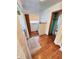 Bright bathroom featuring wood floors, and neutral tiling, plus a convenient linen closet at 6835 W Us Highway 36, Danville, IN 46122