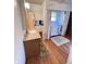 Bathroom with step-in tub, wood floors and vanity with granite top at 6835 W Us Highway 36, Danville, IN 46122