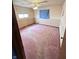 Bedroom with carpet, window, ceiling fan and classic wallpaper border, awaiting personalization at 6835 W Us Highway 36, Danville, IN 46122