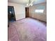 Bedroom featuring carpet, window, ceiling fan and doorway leading to bathroom at 6835 W Us Highway 36, Danville, IN 46122