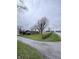 Brick ranch on a corner lot with mature trees and landscaping for privacy and curb appeal at 6835 W Us Highway 36, Danville, IN 46122