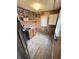 Functional laundry room features wooden walls, sink, storage, and convenient access to the outside at 6835 W Us Highway 36, Danville, IN 46122