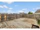 Large wooden backyard deck is ready for entertaining or relaxing at 7951 Busby Bend Dr, Noblesville, IN 46062