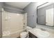 Neutral bathroom with vanity, large mirror, and shower-tub combo at 7951 Busby Bend Dr, Noblesville, IN 46062
