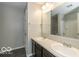 Bright bathroom featuring double sinks, tile floors, and a large mirror at 7951 Busby Bend Dr, Noblesville, IN 46062