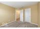 Bedroom with carpeting, neutral paint, closet, and a view of the front yard at 7951 Busby Bend Dr, Noblesville, IN 46062