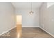 Bright living room features modern lighting, wood-look flooring, and neutral paint at 7951 Busby Bend Dr, Noblesville, IN 46062