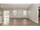 Large living room with access to the kitchen and sliding door to the outdoor patio at 7951 Busby Bend Dr, Noblesville, IN 46062