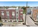Aerial view of modern townhomes with brick and siding exteriors, nestled in a vibrant urban community at 801 Bates St, Indianapolis, IN 46202