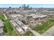 Stunning aerial view showcasing modern townhomes with Indianapolis skyline in the distance, and meticulous landscaping at 801 Bates St, Indianapolis, IN 46202