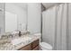 Bathroom featuring a wood vanity with granite countertop and a shower/tub combination at 801 Bates St, Indianapolis, IN 46202