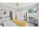 Bright bedroom featuring a walk-in closet, light gray walls, and a modern desk at 801 Bates St, Indianapolis, IN 46202