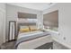 Comfortable bedroom with gray walls, plush carpeting, and two large windows at 801 Bates St, Indianapolis, IN 46202