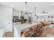 Modern kitchen with stainless appliances, granite counters, pendant lighting, and breakfast bar at 801 Bates St, Indianapolis, IN 46202