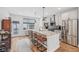 Well-lit kitchen with granite countertop breakfast bar, stainless appliances, and modern pendant lighting at 801 Bates St, Indianapolis, IN 46202