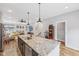 Elegant kitchen showcases an open layout, breakfast bar with barstools, and easy access to living area at 801 Bates St, Indianapolis, IN 46202