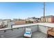 Rooftop deck with city skyline views, perfect for relaxing or entertaining with stylish outdoor seating at 801 Bates St, Indianapolis, IN 46202