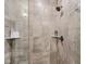 Modern walk-in shower with glass partition and tiled walls, equipped with a rainfall shower head at 801 Bates St, Indianapolis, IN 46202