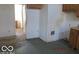 View of the kitchen featuring tile flooring and some wooden cabinets at 909 S Colfax St, Martinsville, IN 46151