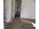 View of a room showing soiled carpet and unfinished walls and doors at 909 S Colfax St, Martinsville, IN 46151