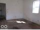 View of a room with carpet, a window providing natural light, and basic wall finishes at 909 S Colfax St, Martinsville, IN 46151
