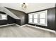 Cozy bedroom featuring gray walls, plush carpet, and lots of natural light at 1015 Main St, Elwood, IN 46036
