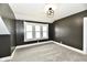 Cozy bedroom featuring gray walls, plush carpet, and lots of natural light at 1015 Main St, Elwood, IN 46036