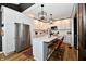 Bright kitchen featuring stainless appliances, white cabinets and a marble countertop island at 1015 Main St, Elwood, IN 46036