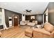 Spacious living room features a sectional sofa, blanket ladder, and wood floors creating a cozy atmosphere at 1015 Main St, Elwood, IN 46036