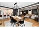 Open-concept living room with modern lighting, hardwood floors and comfortable seating at 1015 Main St, Elwood, IN 46036