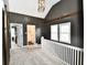 Loft area with neutral carpet and lots of natural light at 1015 Main St, Elwood, IN 46036