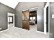 Spacious main bedroom featuring a unique sliding barn door and plush gray carpet at 1015 Main St, Elwood, IN 46036