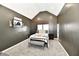 Beautiful main bedroom features vaulted ceilings, wood beam, and neutral color palette at 1015 Main St, Elwood, IN 46036