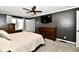 Comfortable main bedroom with natural lighting and a wooden dresser at 1015 Main St, Elwood, IN 46036