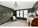 Bright office featuring gray walls, plush carpet, and lots of natural light at 1015 Main St, Elwood, IN 46036