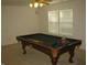 Spacious game room featuring a classic pool table and window views at 10762 Galant Fox Ct, Indianapolis, IN 46234
